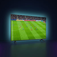 Samsung 43-inch Crystal UHD 4K TV showing a vivid live soccer match, premium dark studio with cyan glow