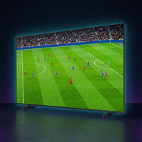 Samsung 85-inch Mini LED 4K TV showing a vivid live soccer match, premium dark studio with cyan glow