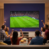 Group of friends watching a live soccer match together on a wall-mounted Samsung 85-inch 4K TV